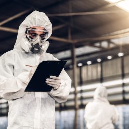 Scientist wear Chemical protection suit check danger chemical, working at dangerous zone. Healthcare workers wearing hazmat suits working together to control an outbreak